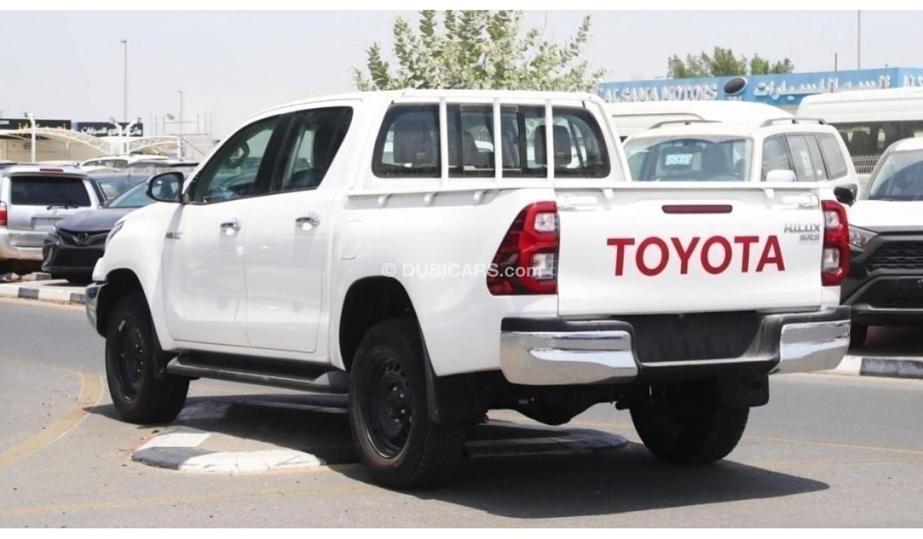 Toyota Hilux 2.4L diesel  . White 2023 model, M/T Wide body with Chrome bumper