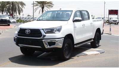 تويوتا هيلوكس 2.4L diesel  . White 2023 model, M/T Wide body with Chrome bumper