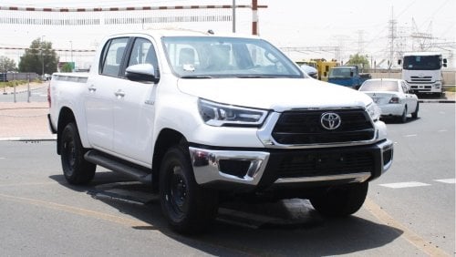 Toyota Hilux 2.4L diesel  . White 2024 model, M/T Wide body with Chrome bumper