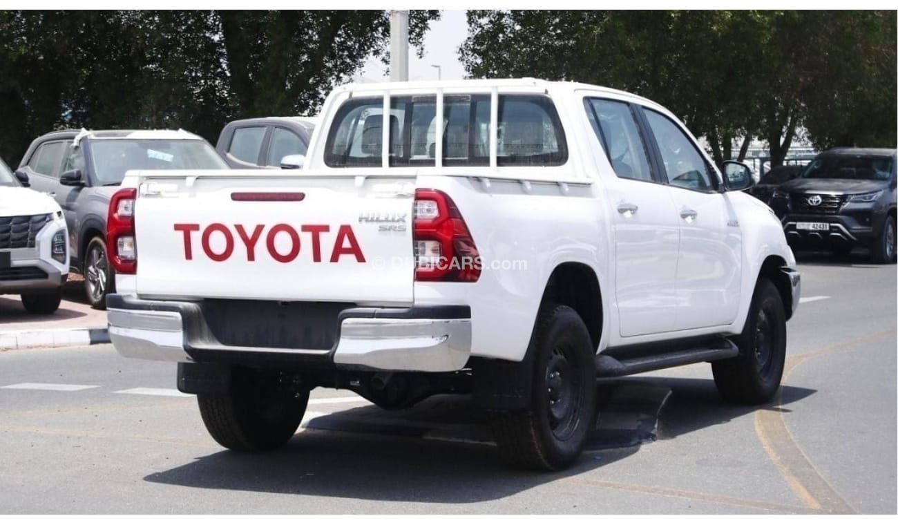 Toyota Hilux 2.4L diesel  . White 2023 model, M/T Wide body with Chrome bumper