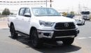 تويوتا هيلوكس 2.4L diesel  . White 2023 model, M/T Wide body with Chrome bumper