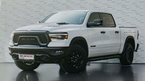 RAM 1500 AED 3,302 PM • RAM 1500 REBEL LUXURY • ONLY 28,000 KMS • 5.7L HEMI® V8 • OFFICIAL DODGE WARRANTY