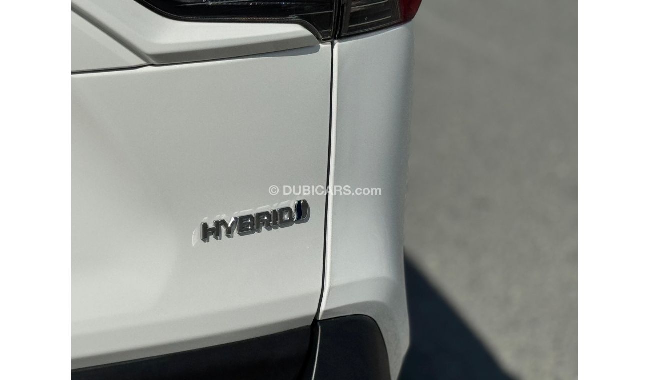 Toyota RAV4 Toyota RAV4 2024 Hybrid – White 	•	Engine & Performance: 2.5L 4-cylinder hybrid engine paired with a