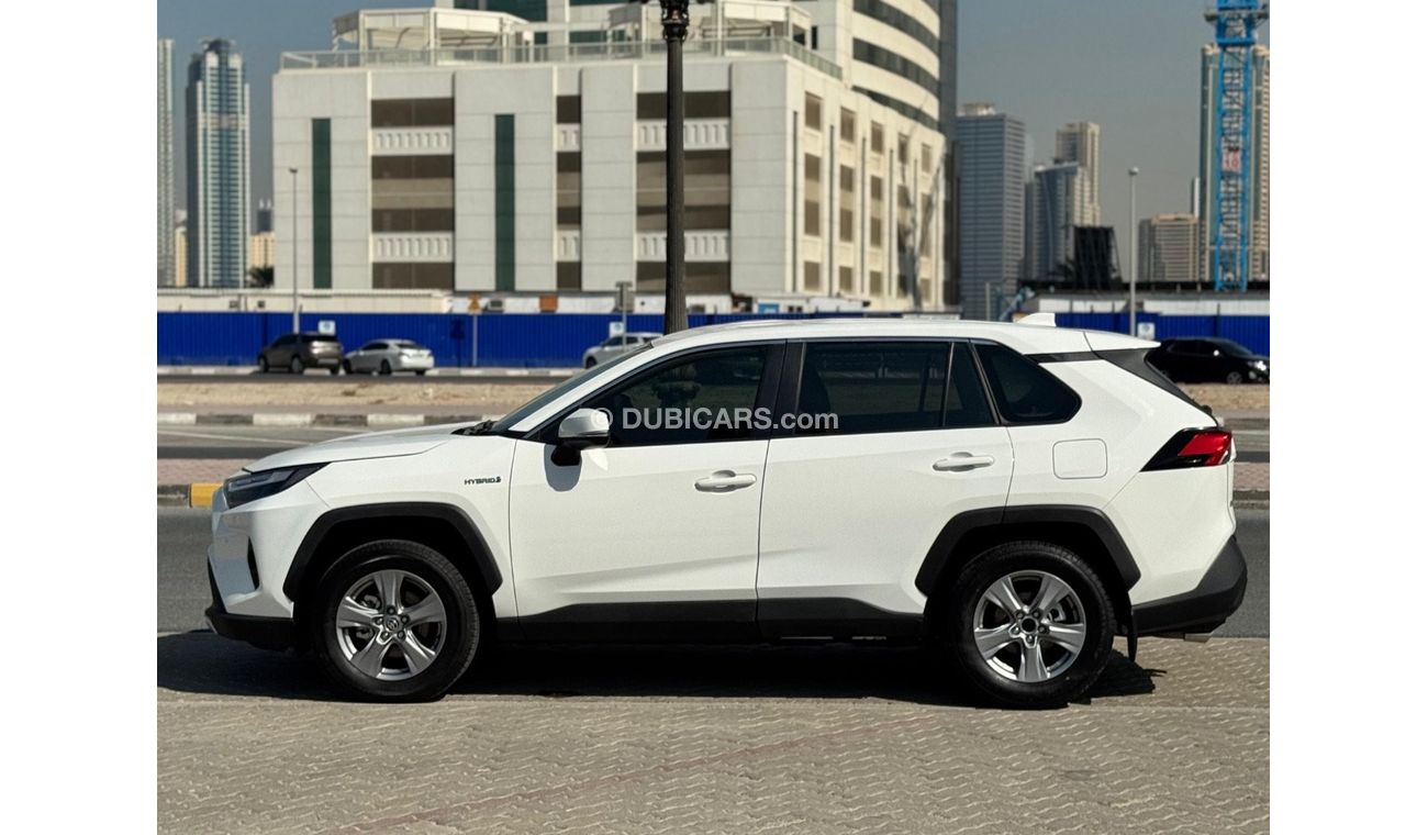 Toyota RAV4 Toyota RAV4 2024 Hybrid – White 	•	Engine & Performance: 2.5L 4-cylinder hybrid engine paired with a