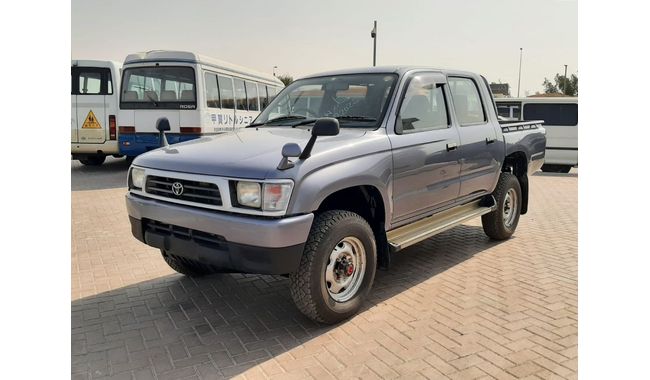 1999 maroon toyota hilux 4x4 pickup