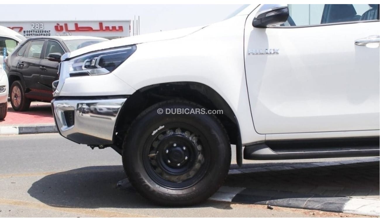 Toyota Hilux 2.4L diesel  . White 2023 model, M/T Wide body with Chrome bumper