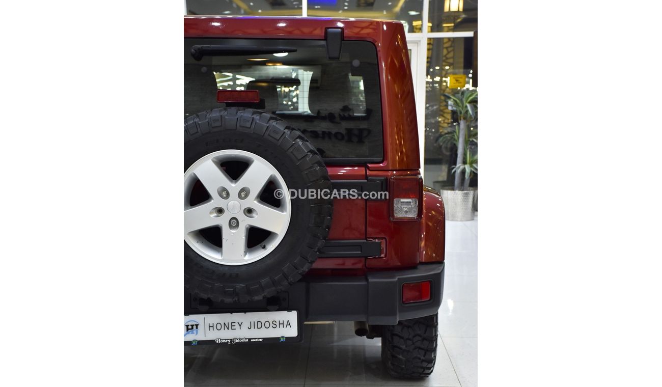 Jeep Wrangler EXCELLENT DEAL for our Jeep Wrangler Unlimited SAHARA ( 2012 Model ) in Maroon Color GCC Specs