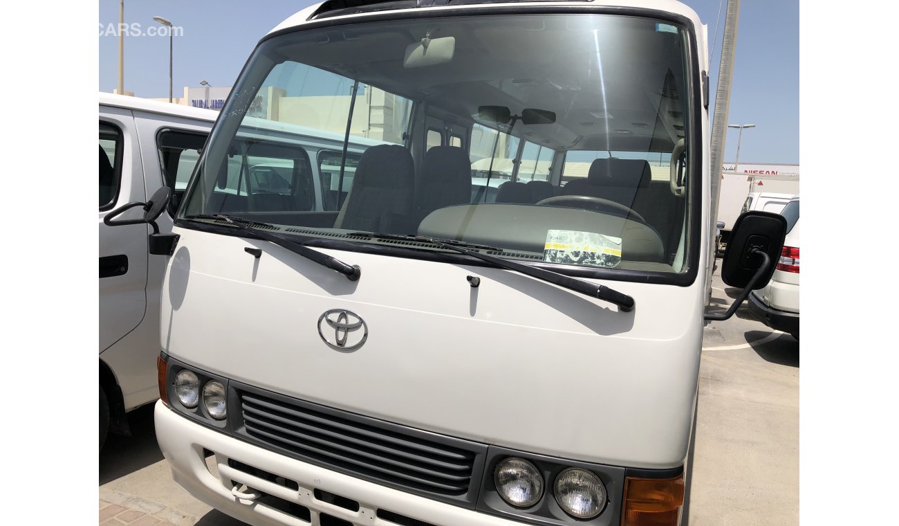 Used Toyota Coaster 26 str bus Model 1999. Free of accident with