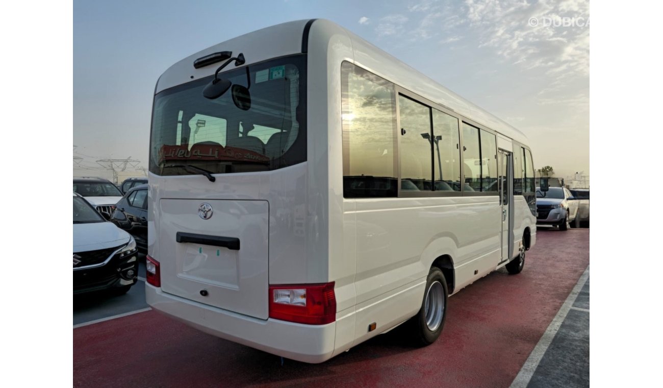 تويوتا كوستر 2024 TOYOTA COASTER 4.0L V6 22 SEATER 3 POINT BELT WITH COOL BOX, CURTAINS, LUGGAGE RACK