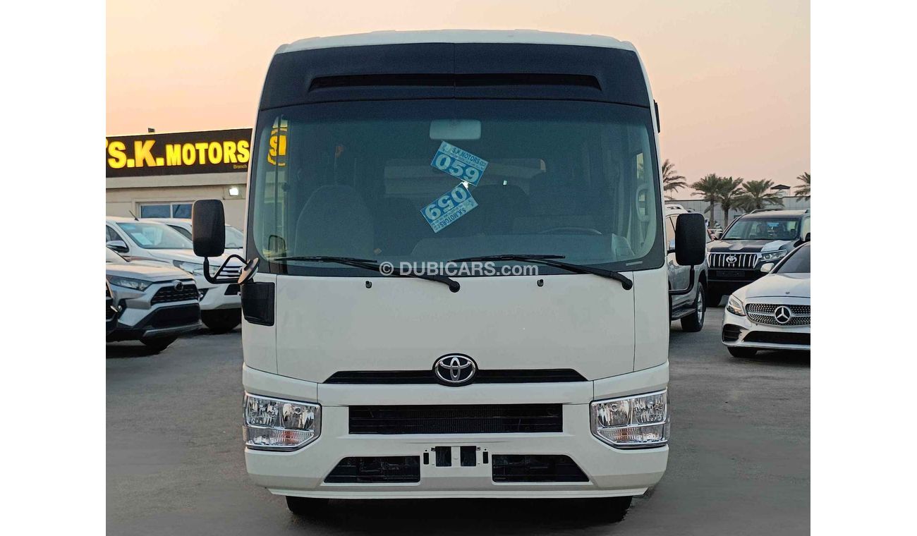 Toyota Coaster // MANUAL // 4.2L V6 //  DIESEL //  23 STRS (LOT # 10854)