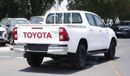 Toyota Hilux 2.4L diesel  . White 2023 model, M/T Wide body with Chrome bumper