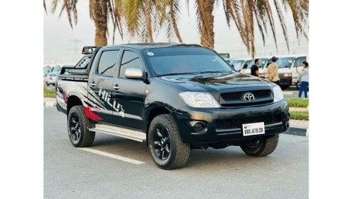 Toyota Hilux DOUBLE CABIN | PREMIUM SPORTS BAR WITH BASKET | 2009 | 2.7L PETROL | LHD | MANUAL | RED INTERIOR