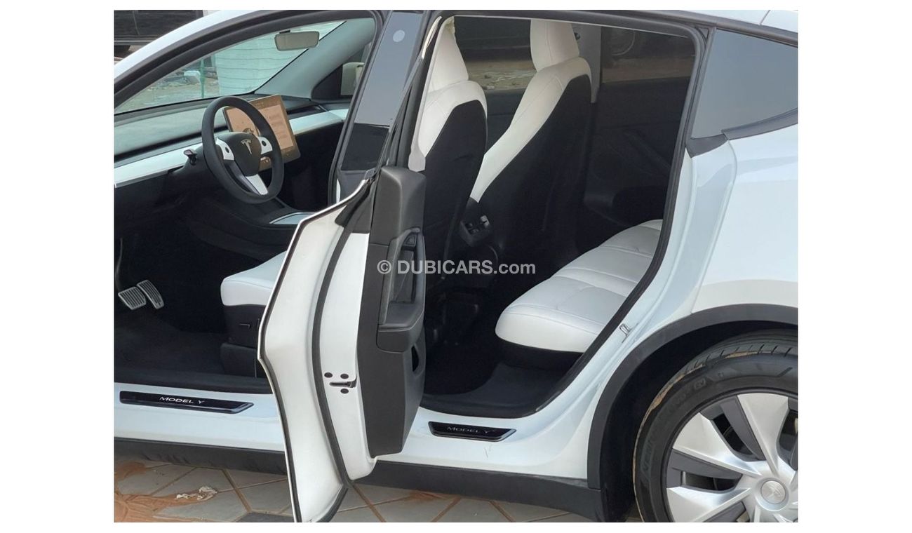 Tesla Model Y TESLA MODEL Y LONG RANGE DUAL MOTOR MODEL : 2023 MILEAGE : 24,000 km PRICE : 172,000 DIRHAMS Gulf sp