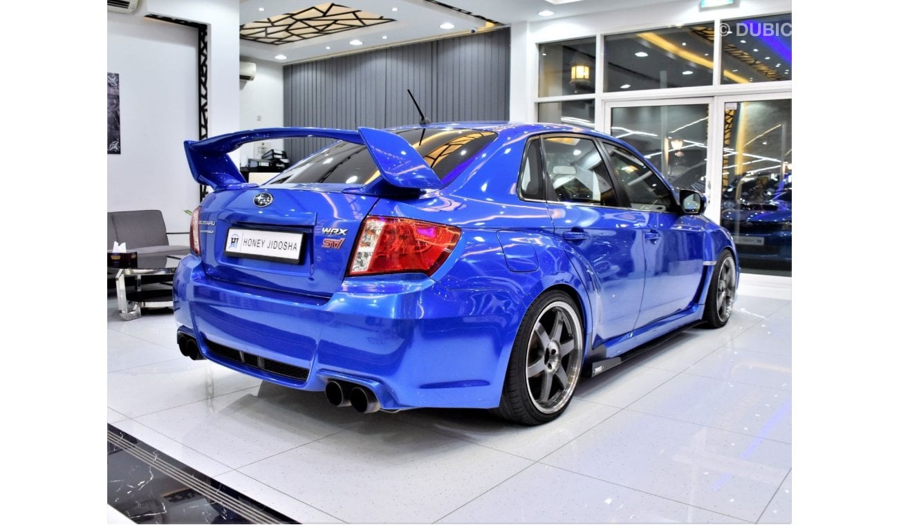 Subaru Impreza WRX EXCELLENT DEAL for our Subaru WRX STi AWD ( 2011 Model ) in Blue Color GCC Specs