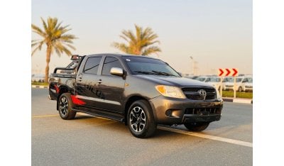 Toyota Hilux DOUBLE CABIN | PREMIUM SPORTS BAR WITH BASKET | 2.7L PETROL | MANUAL | RED INTERIOR | SIDE BODY STIC