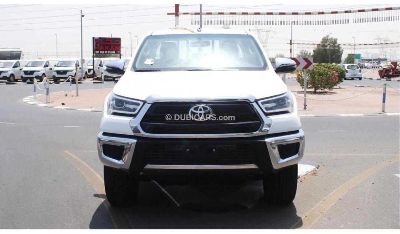 Toyota Hilux 2.4L diesel  . White 2023 model, M/T Wide body with Chrome bumper