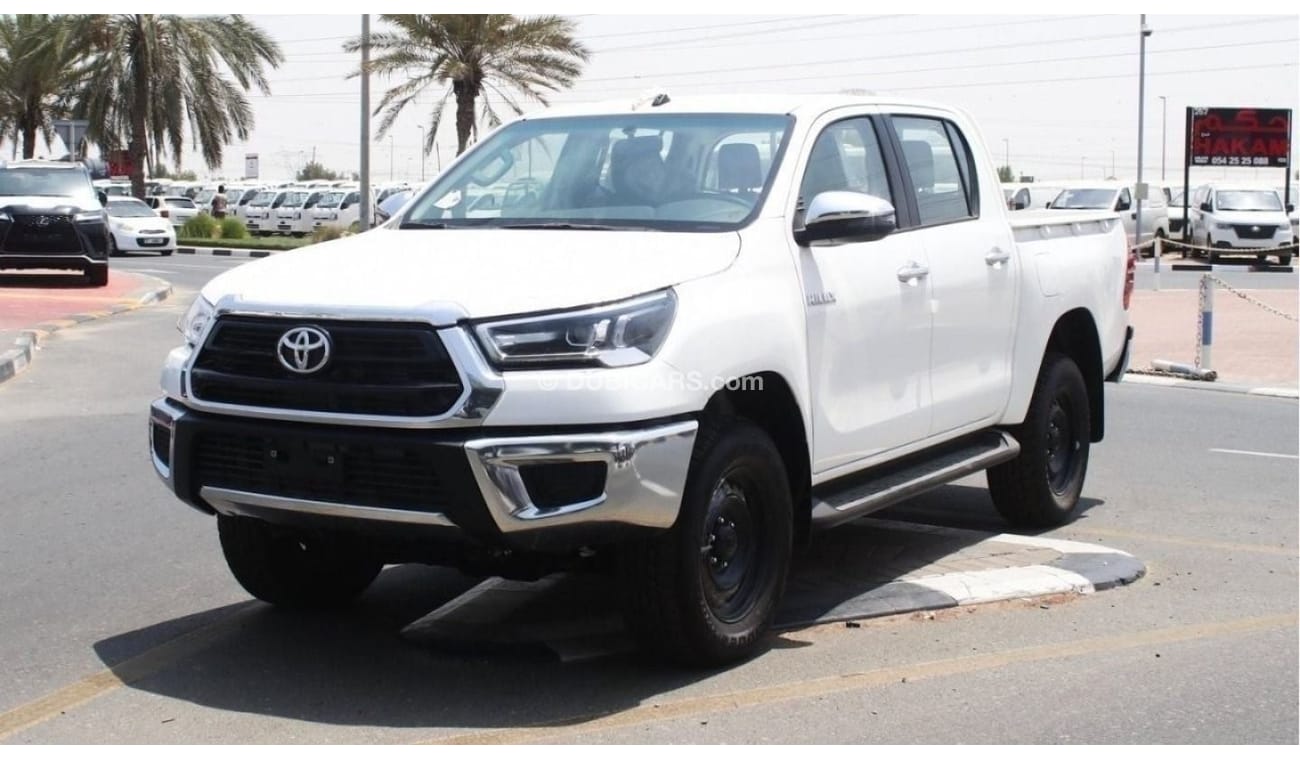 Toyota Hilux 2.4L diesel  . White 2023 model, M/T Wide body with Chrome bumper