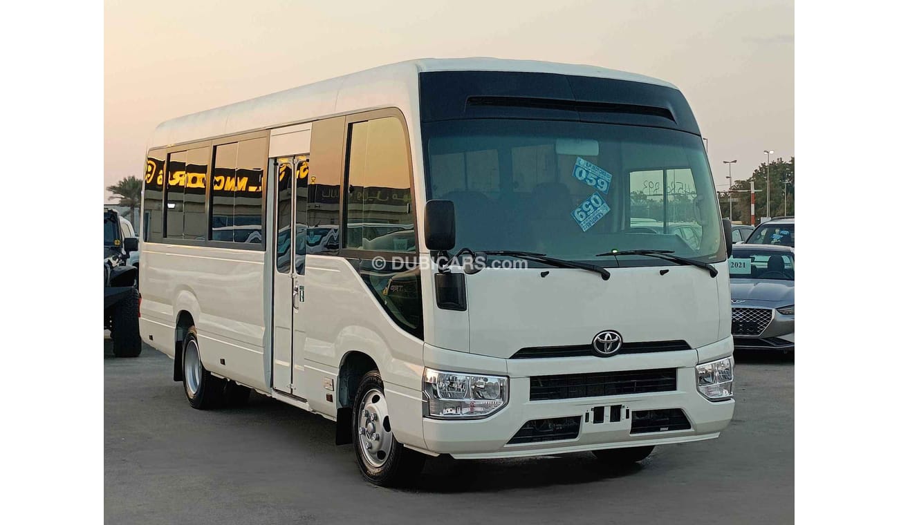 Toyota Coaster // MANUAL // 4.2L V6 //  DIESEL //  23 STRS (LOT # 10854)