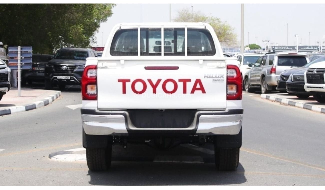 Toyota Hilux 2.4L diesel  . White 2023 model, M/T Wide body with Chrome bumper