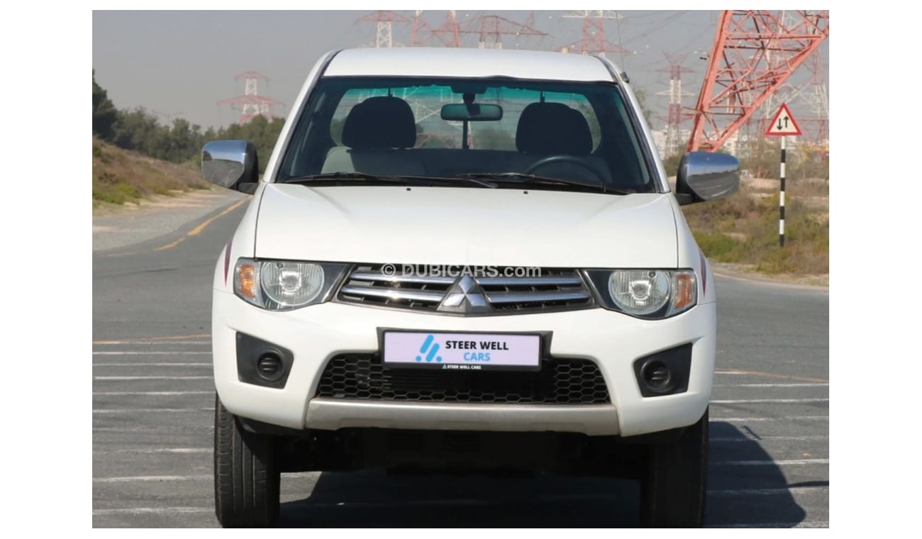 Mitsubishi L200 2015 |  L200 D/C 4X4 DIESEL MT WITH GCC SPECS AND EXCELLENT CONDITION