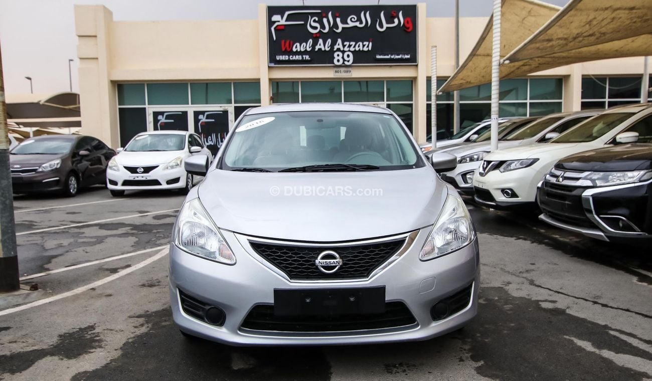 Nissan Tiida Pre-owned  for sale in Sharjah. Grey/Silver 2016 model, available at Wael Al Azzazi Shar