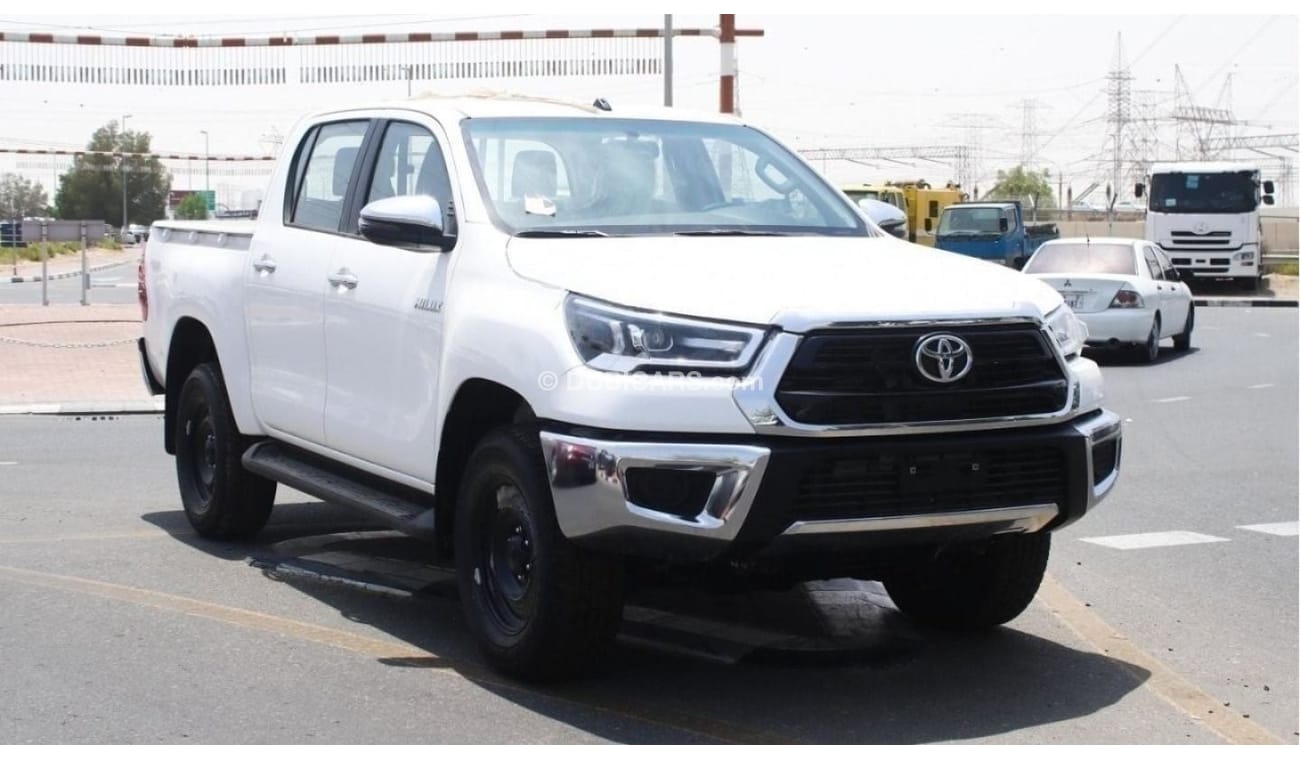 Toyota Hilux 2.4L diesel  . White 2023 model, M/T Wide body with Chrome bumper