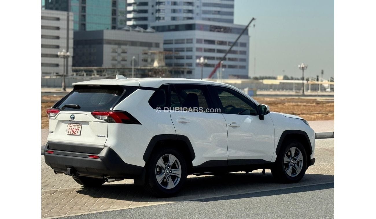 Toyota RAV4 Toyota RAV4 2024 Hybrid – White 	•	Engine & Performance: 2.5L 4-cylinder hybrid engine paired with a