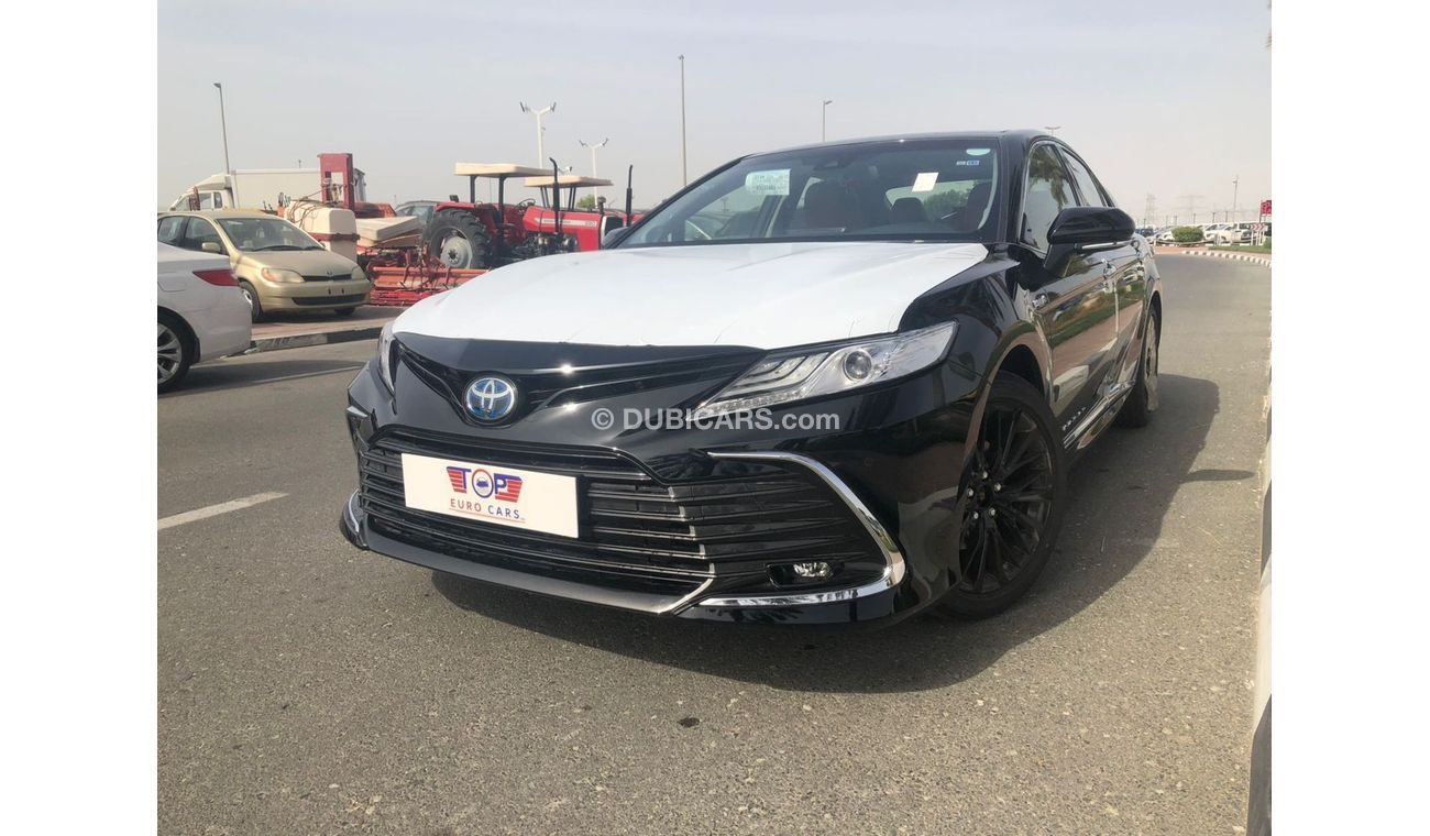 Toyota Camry TOYOTA_CAMERY_GRANDE_HYBRID_2023_BLACK_WHITE