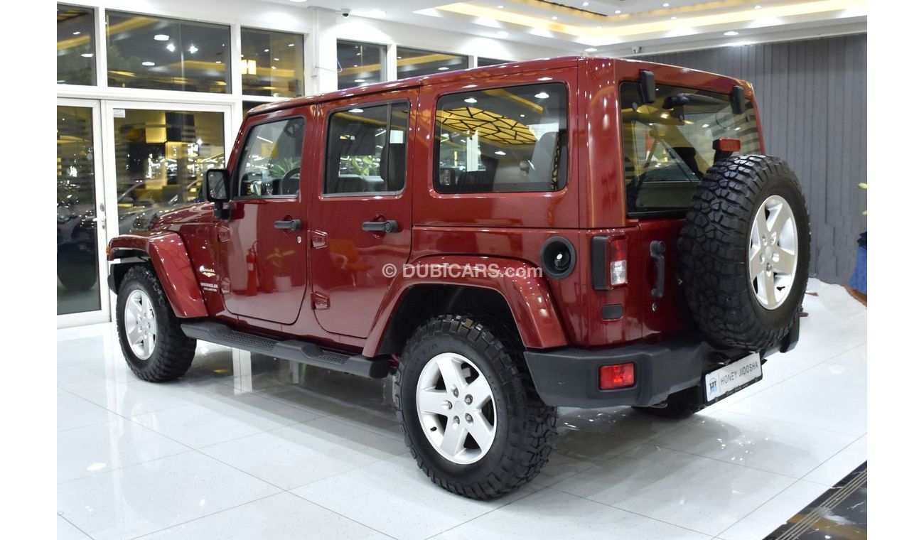 Jeep Wrangler EXCELLENT DEAL for our Jeep Wrangler Unlimited SAHARA ( 2012 Model ) in Maroon Color GCC Specs