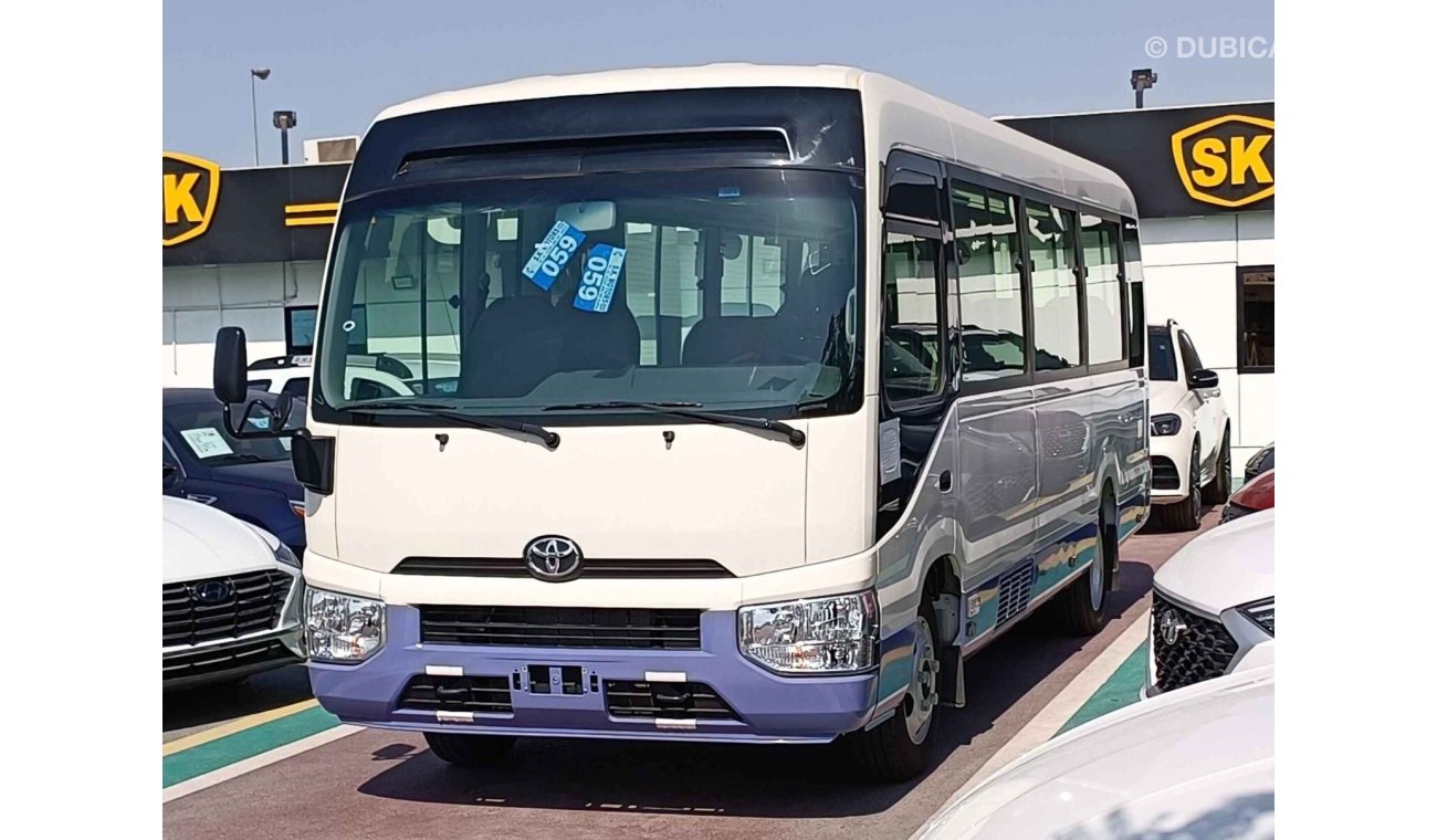 تويوتا كوستر 4.2L V6 DIESEL / 23 STR M/T / AUTO DOOR /  LUGGAGE RACKS (CODE # CD42B)