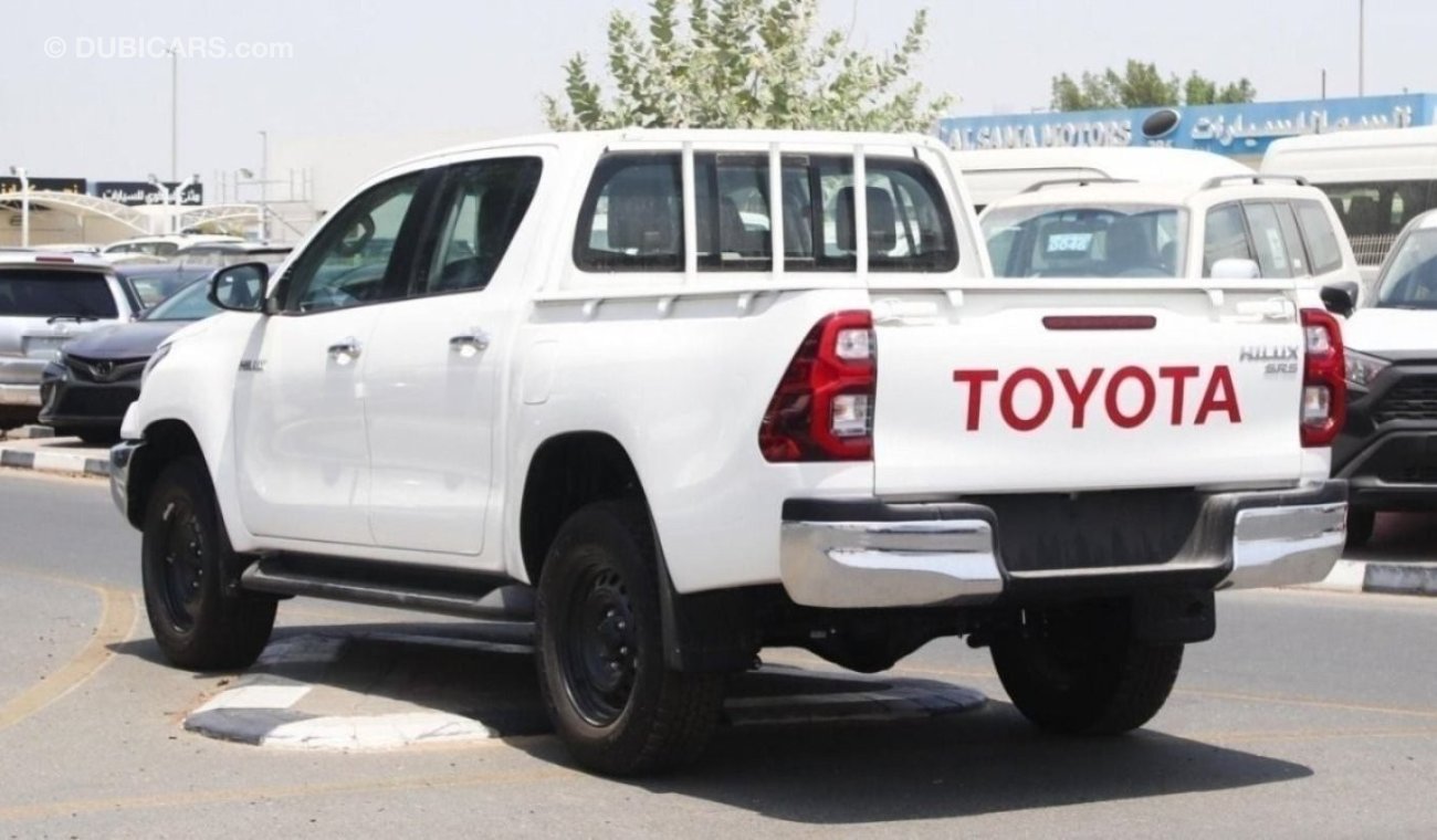 Toyota Hilux 2.4L diesel  . White 2023 model, M/T Wide body with Chrome bumper