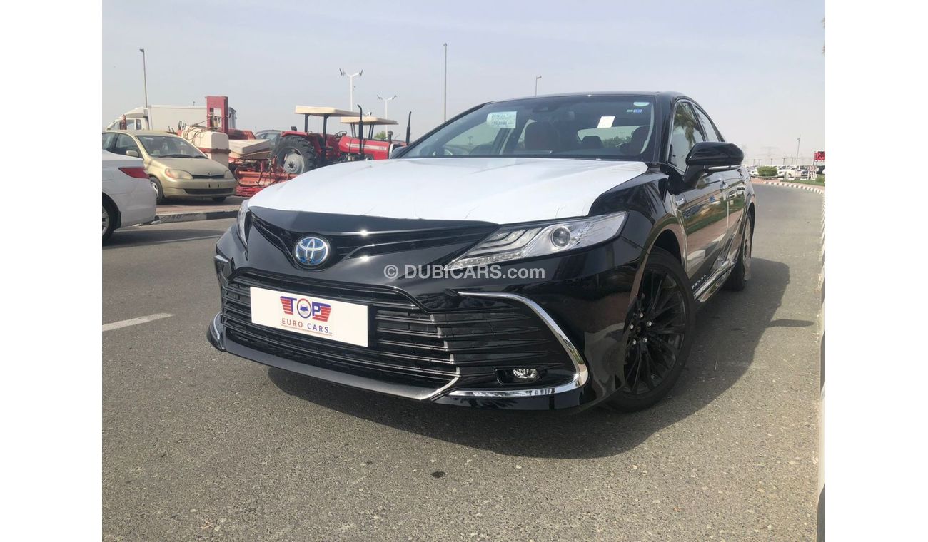 Toyota Camry TOYOTA_CAMERY_GRANDE_HYBRID_2023_BLACK_WHITE