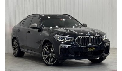 بي أم دبليو X6 50i Exclusive 4.4L 2021 BMW X6 M50i, 2026 AGMC Agency Warranty + Service Package, Full Service Histo