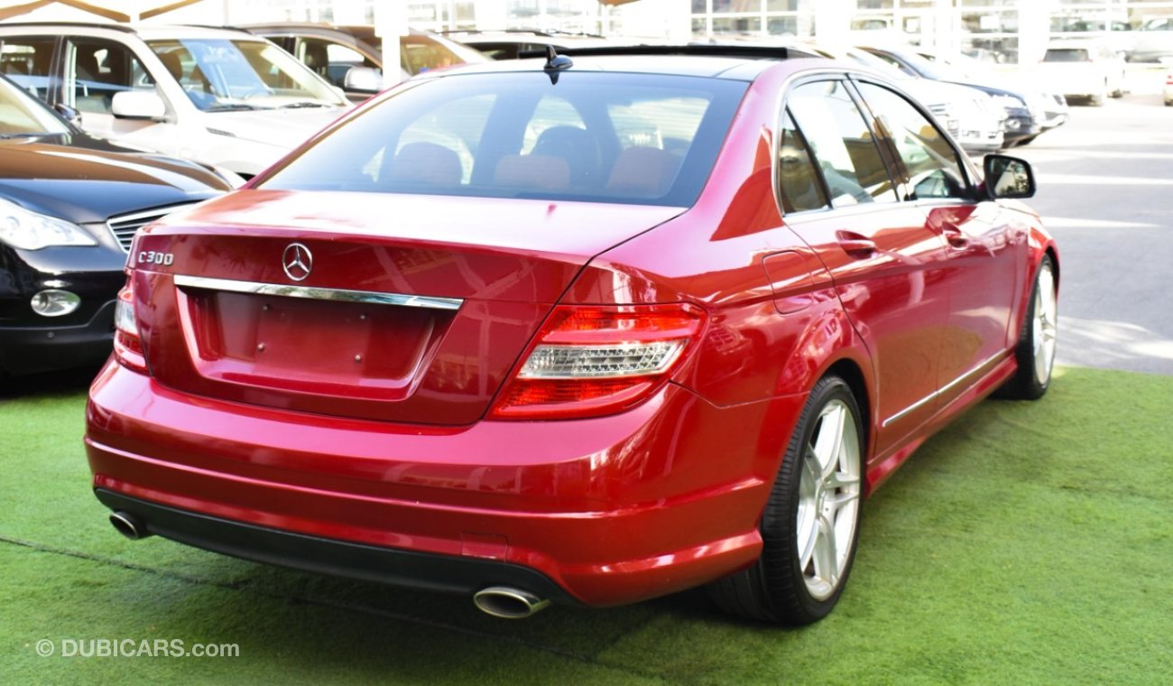 Mercedes-Benz C 300 2009 model, red color, number one, panorama, leather, cruise control, sensor wheels, in excellent co