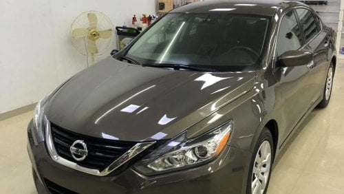 Nissan Altima Nissan altima clean and neat car for sale In Sharjah haraj showroom Number 327 for further informati