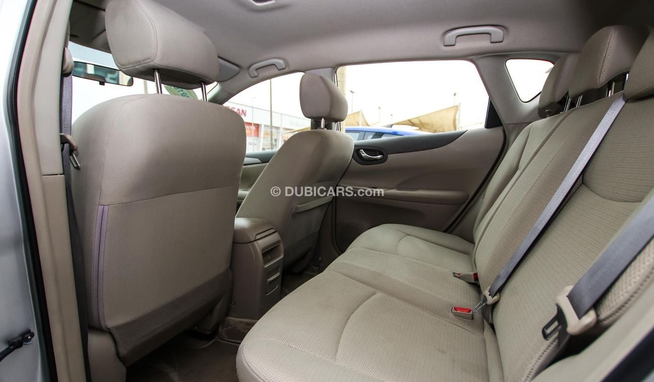 Nissan Tiida Pre-owned  for sale in Sharjah. Grey/Silver 2016 model, available at Wael Al Azzazi Shar