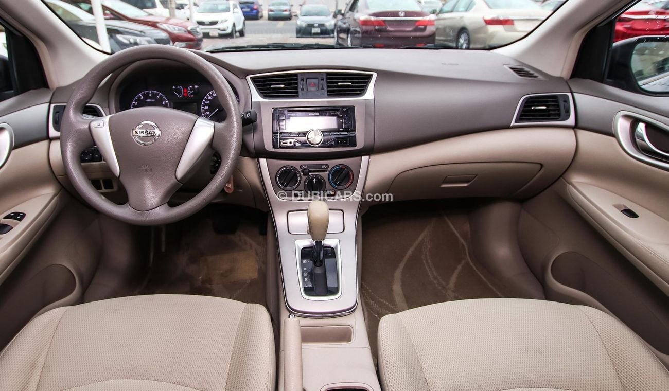 Nissan Tiida Pre-owned  for sale in Sharjah. Grey/Silver 2016 model, available at Wael Al Azzazi Shar