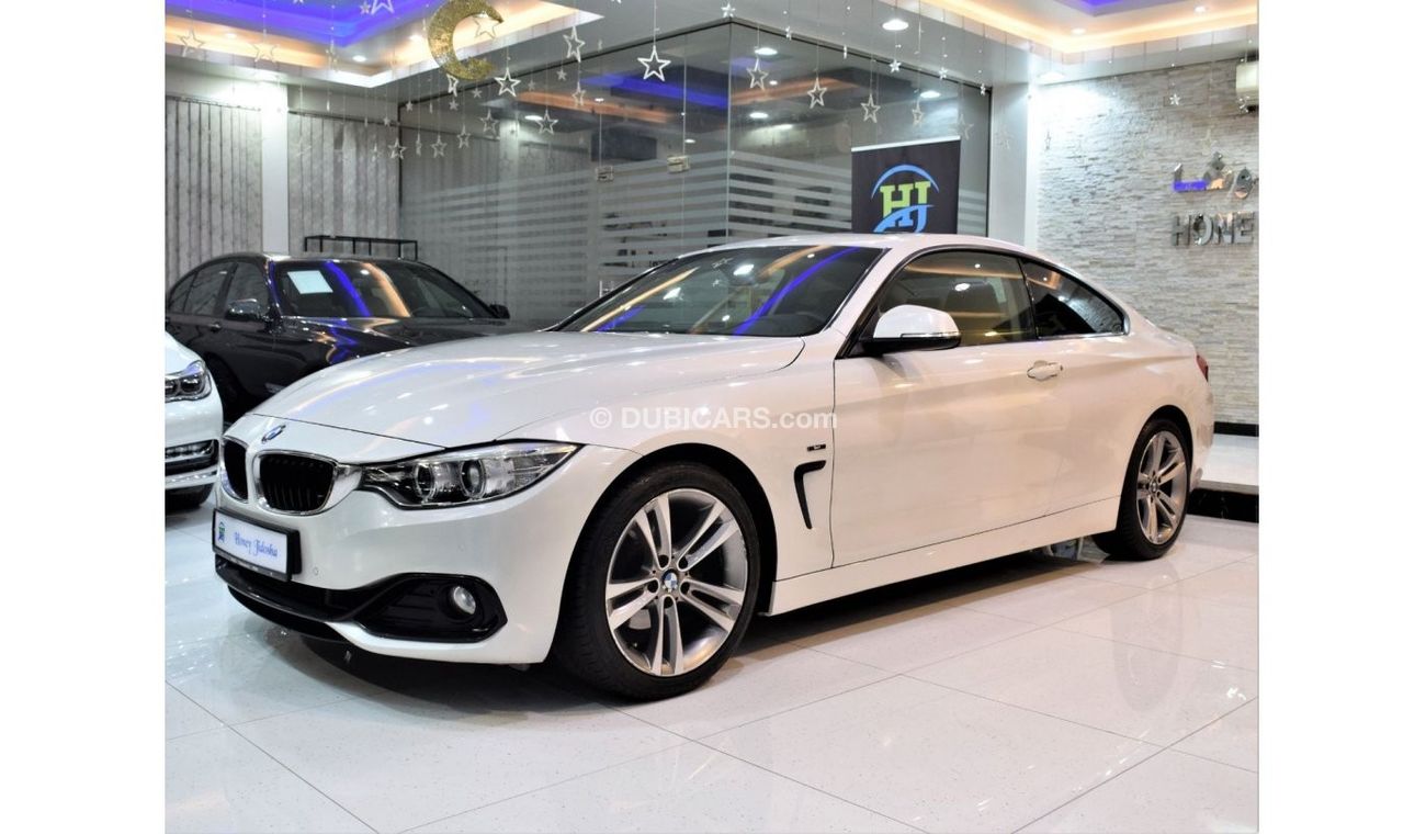 BMW 420i EXCELLENT DEAL for our BMW 420i Sport ( 435i Badge ) ( 2015 Model! ) in White Color! GCC Specs