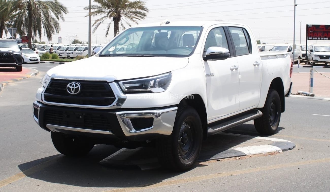 Toyota Hilux 2.4L diesel  . White 2024 model, M/T Wide body with Chrome bumper